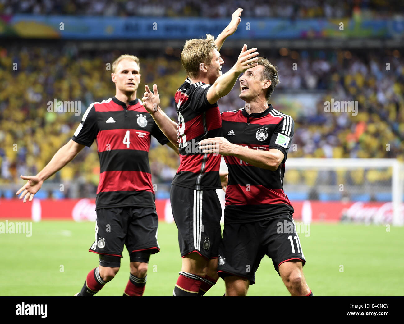 Belo Horizonte, Brazil. 8th July, 2014. Germany's Miroslav Klose (R) celebrates after Toni Kroos (C) scoring a goal during a semifinal match between Brazil and Germany of 2014 FIFA World Cup at the Estadio Mineirao Stadium in Belo Horizonte, Brazil, on July 8, 2014. Credit:  Qi Heng/Xinhua/Alamy Live News Stock Photo
