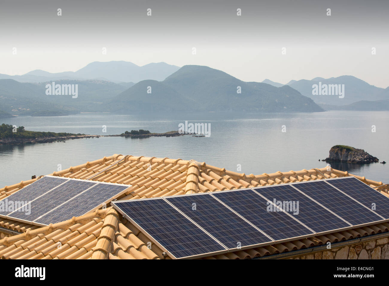 Solar panels on a house roof in Sivota, Greece. Stock Photo