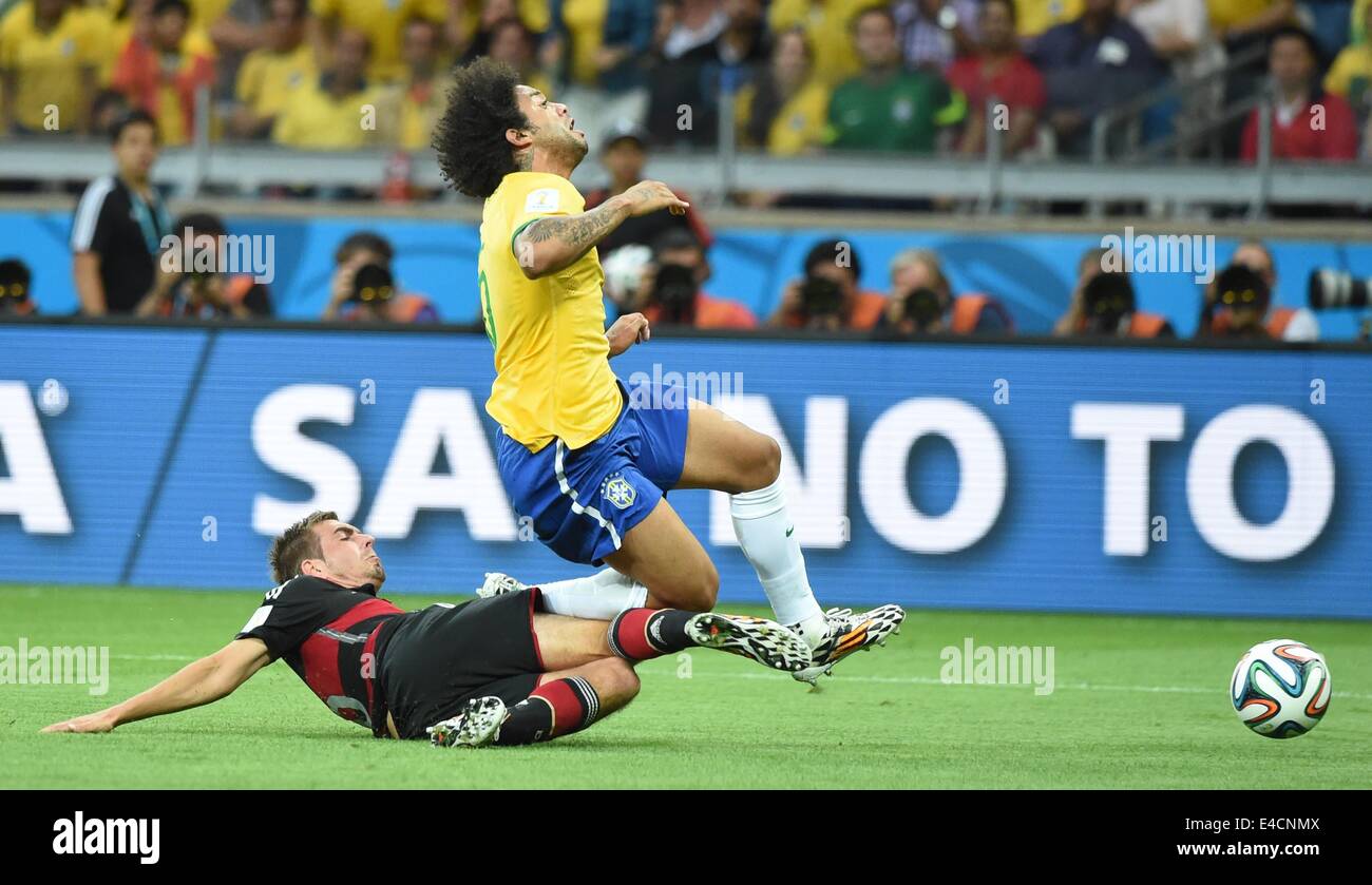 Belo Horizonte, Brazil. 8th July, 2014. Germany's Philipp Lahm (L) tackles Brazil's Marcelo during a semifinal match between Brazil and Germany of 2014 FIFA World Cup at the Estadio Mineirao Stadium in Belo Horizonte, Brazil, on July 8, 2014. Credit:  Liu Dawei/Xinhua/Alamy Live News Stock Photo