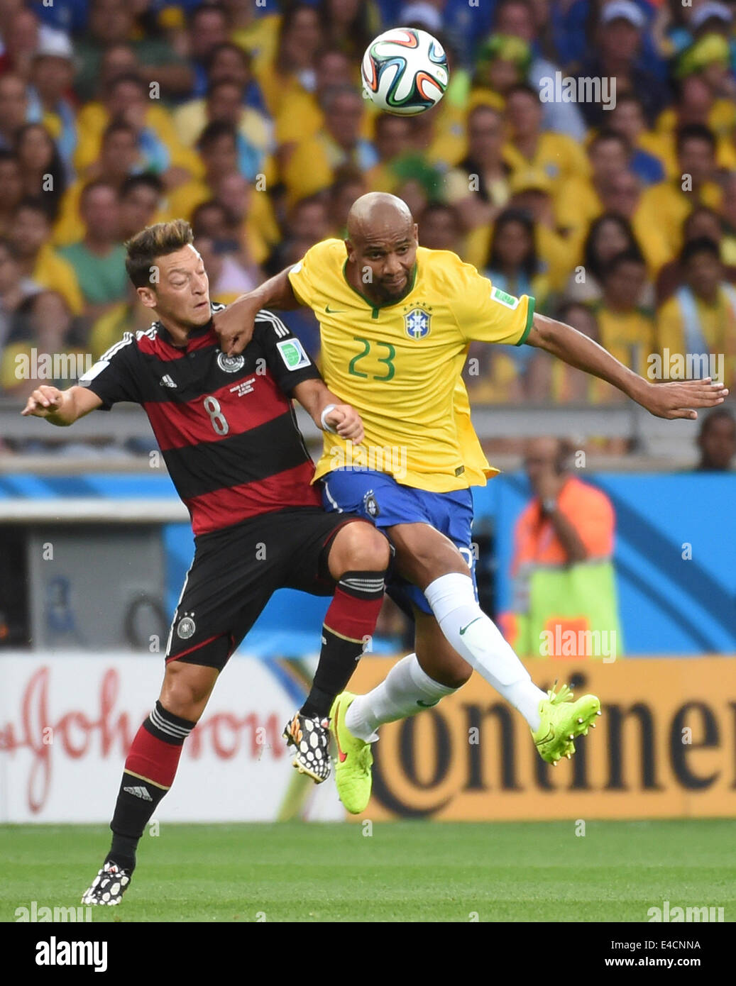 (140708) -- BELO HORIZONTE, July 8, 2014 (Xinhua) -- Brazil's Maicon vies with Germany's Mesut Ozil during a semifinal match between Brazil and Germany of 2014 FIFA World Cup at the Estadio Mineirao Stadium in Belo Horizonte, Brazil, on July 8, 2014. Stock Photo