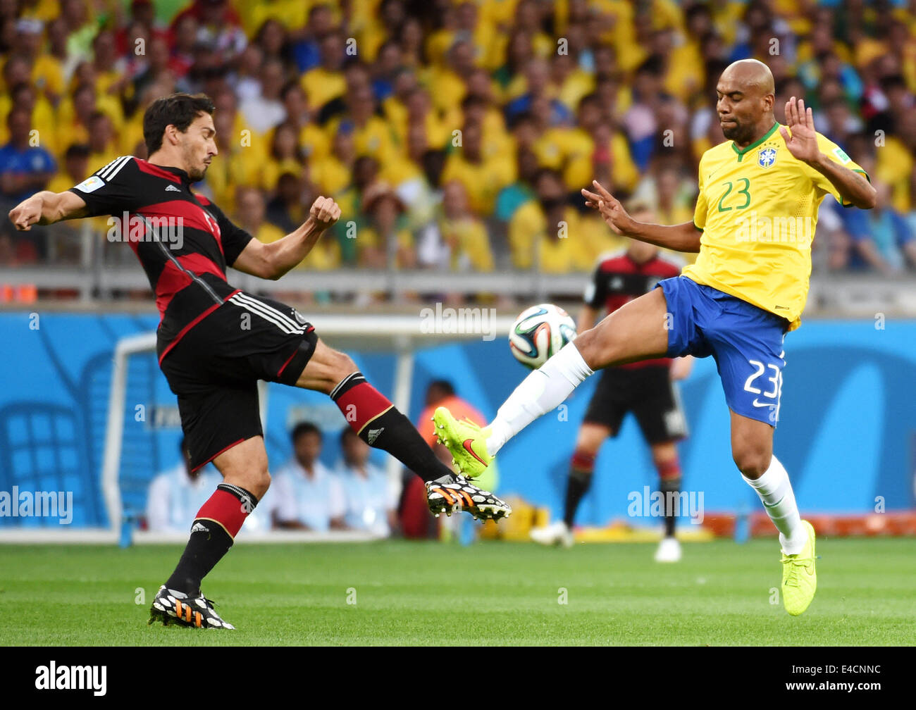 Belo Horizonte, Brazil. 8th July, 2014. Brazil's Maicon vies with Germany's Mats Hummels during a semifinal match between Brazil and Germany of 2014 FIFA World Cup at the Estadio Mineirao Stadium in Belo Horizonte, Brazil, on July 8, 2014. Credit:  Li Ga/Xinhua/Alamy Live News Stock Photo