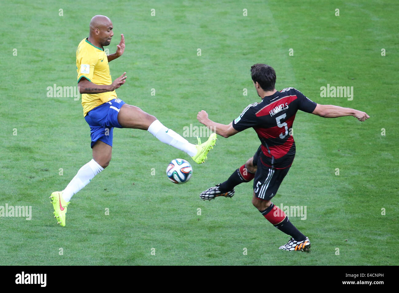 Belo Horizonte, Brazil. 8th July, 2014. Brazil's Maicon vies with Germany's Mats Hummels during a semifinal match between Brazil and Germany of 2014 FIFA World Cup at the Estadio Mineirao Stadium in Belo Horizonte, Brazil, on July 8, 2014. Credit:  Li Ming/Xinhua/Alamy Live News Stock Photo