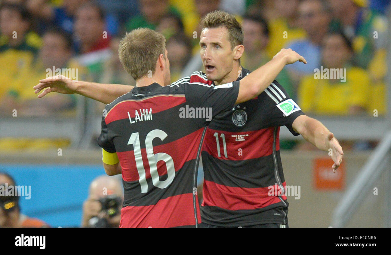 Belo Horizonte, Brazil. 08th July, 2014. Miroslav Klose (R) of Germany celebrates with his teammate Philipp Lahm (L) after the scoring 0-2 goal during the FIFA World Cup 2014 semi-final soccer match between Brazil and Germany at Estadio Mineirao in Belo Horizonte, Brazil, 08 July 2014. Photo: Thomas Eisenhuth/dpa/Alamy Live News Stock Photo