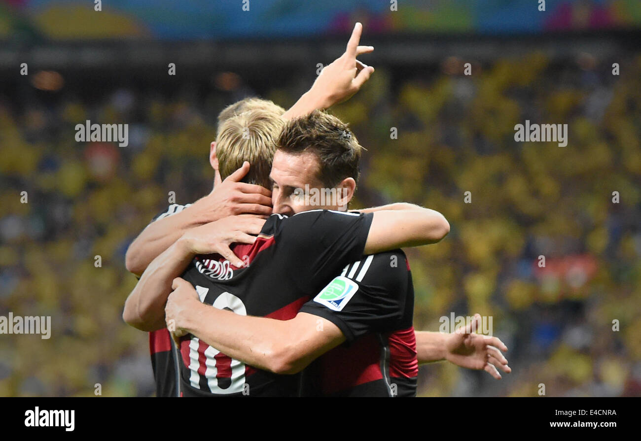 Belo Horizonte, Brazil. 08th July, 2014. Toni Kroos (L) of Germany celebrates with his teammate Miroslav Klose (R) after the scoring a goal during the FIFA World Cup 2014 semi-final soccer match between Brazil and Germany at Estadio Mineirao in Belo Horizonte, Brazil, 08 July 2014. Photo: Marcus Brandt/dpa/Alamy Live News Stock Photo