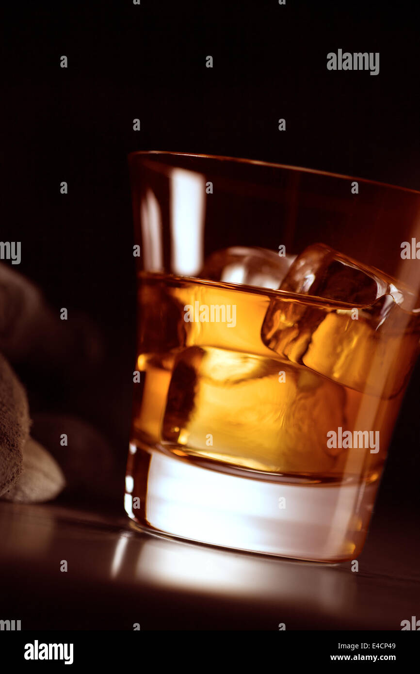Brown liquor on ice in short glass Stock Photo Alamy