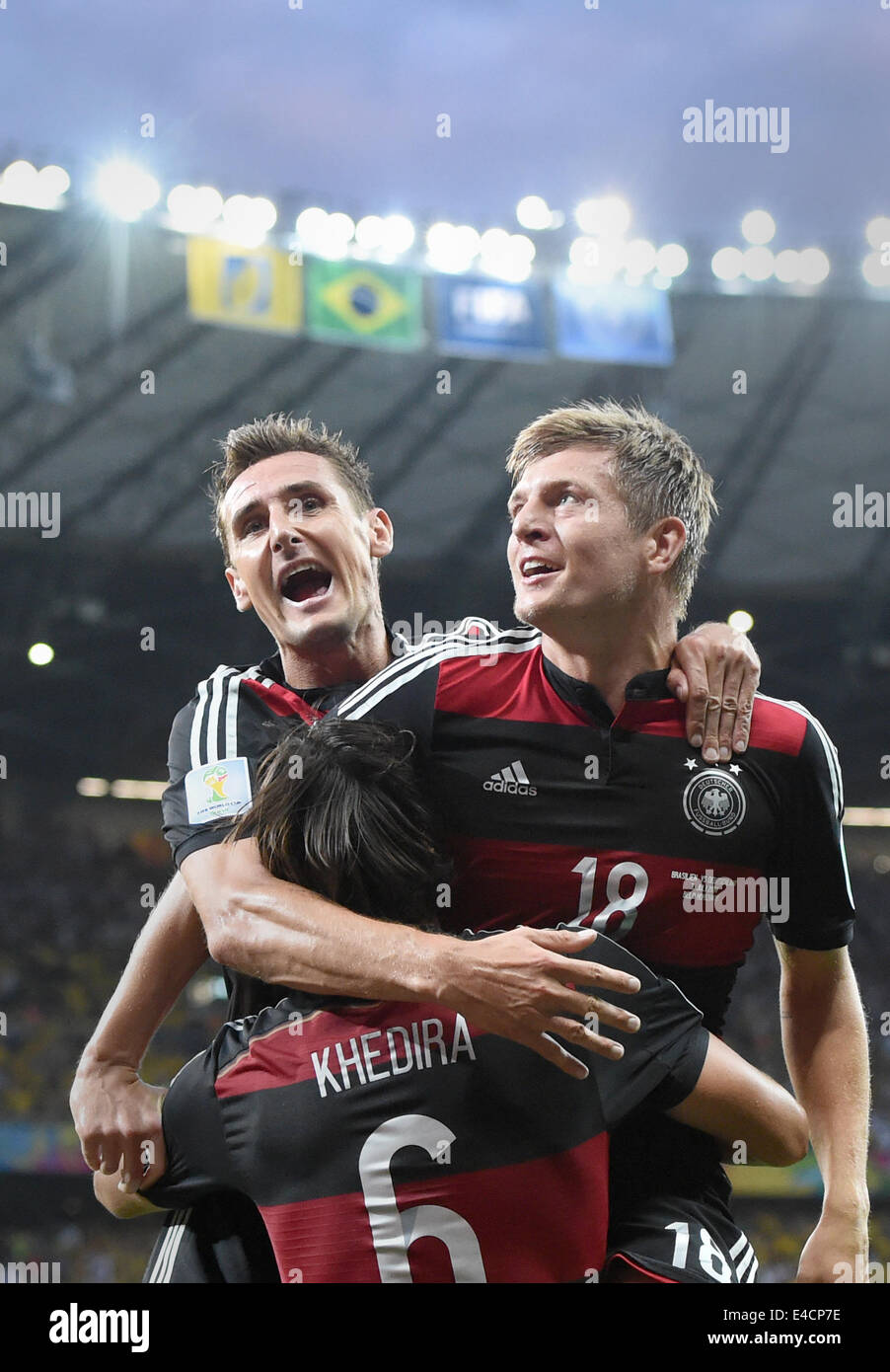 Belo Horizonte, Brazil. 08th July, 2014. Toni Kroos (R) of Germany celebrates with his teammate Miroslav Klose (L) and Sami Khedira after the scoring a goal during the FIFA World Cup 2014 semi-final soccer match between Brazil and Germany at Estadio Mineirao in Belo Horizonte, Brazil, 08 July 2014. Photo: Marcus Brandt/dpa/Alamy Live News Stock Photo