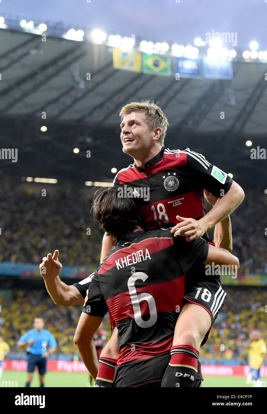 Belo Horizonte, Brazil. 08th July, 2014. Toni Kroos (top) of Germany celebrates with his teammate Miroslav Klose (L) and Sami Khedira after the scoring a goal during the FIFA World Cup 2014 semi-final soccer match between Brazil and Germany at Estadio Mineirao in Belo Horizonte, Brazil, 08 July 2014. Photo: Marcus Brandt/dpa/Alamy Live News Stock Photo