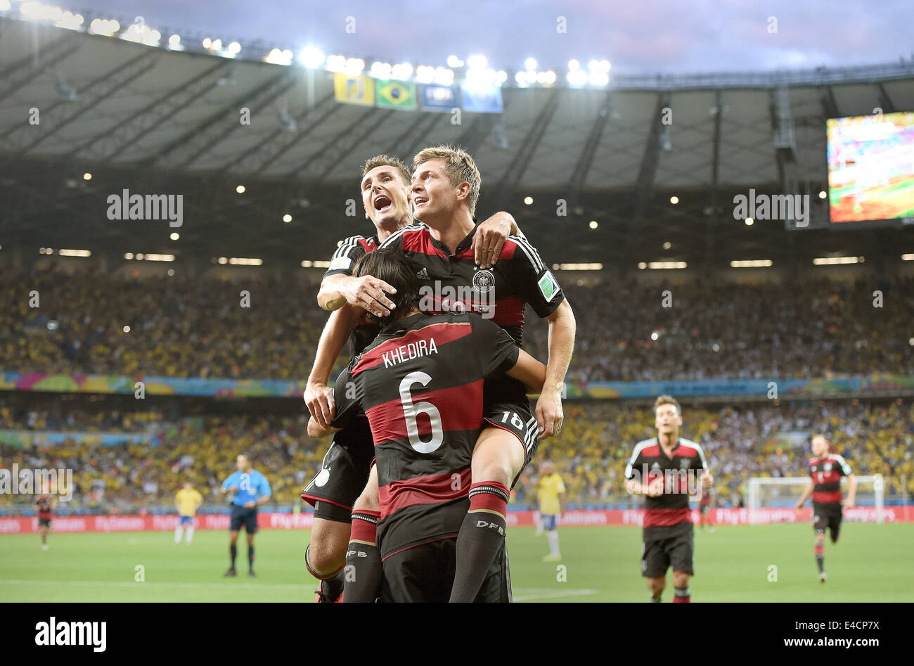 Belo Horizonte, Brazil. 08th July, 2014. Toni Kroos (R) of Germany celebrates with his teammate Miroslav Klose (L) and Sami Khedira after the scoring a goal during the FIFA World Cup 2014 semi-final soccer match between Brazil and Germany at Estadio Mineirao in Belo Horizonte, Brazil, 08 July 2014. Photo: Marcus Brandt/dpa/Alamy Live News Stock Photo