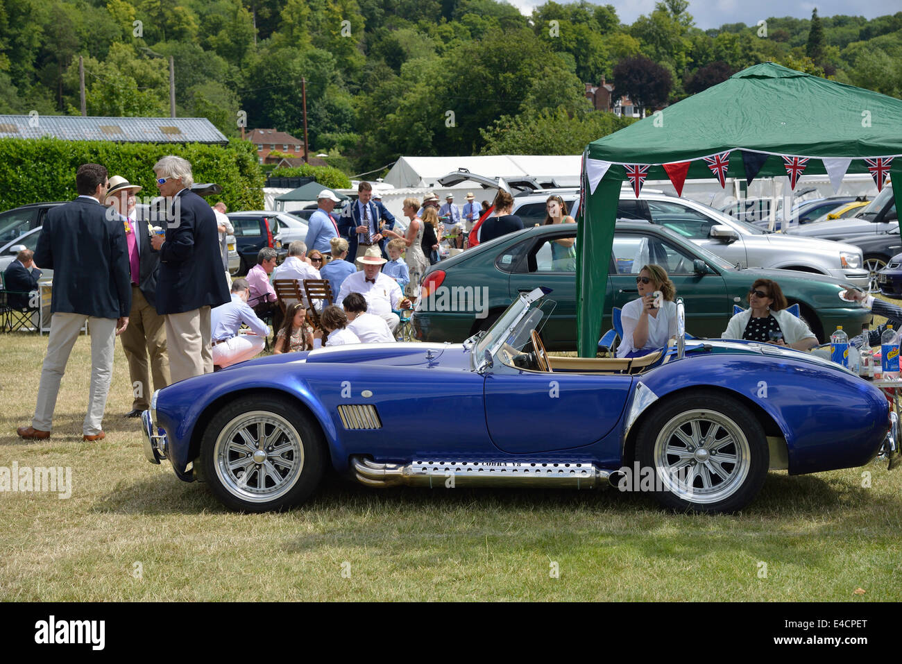 Blue sports car parked with table ready for a buffet lunch at the Henley Royal Regatta 2014,Henley-on-Thames,Oxfordshire,England Stock Photo