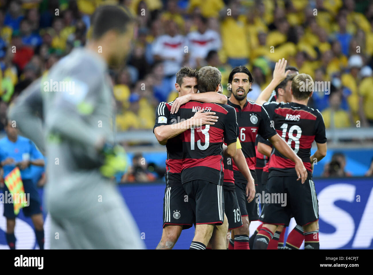Belo Horizonte, Brazil. 08th July, 2014. Miroslav Klose (L-R) of Germany celebrates with his teammmates Thomas Mueller, Sami Khedira and Toni Kroos after scoring 0-2 goal during the FIFA World Cup 2014 semi-final soccer match between Brazil and Germany at Estadio Mineirao in Belo Horizonte, Brazil, 08 July 2014. Photo: Marcus Brandt/dpa/Alamy Live News Stock Photo