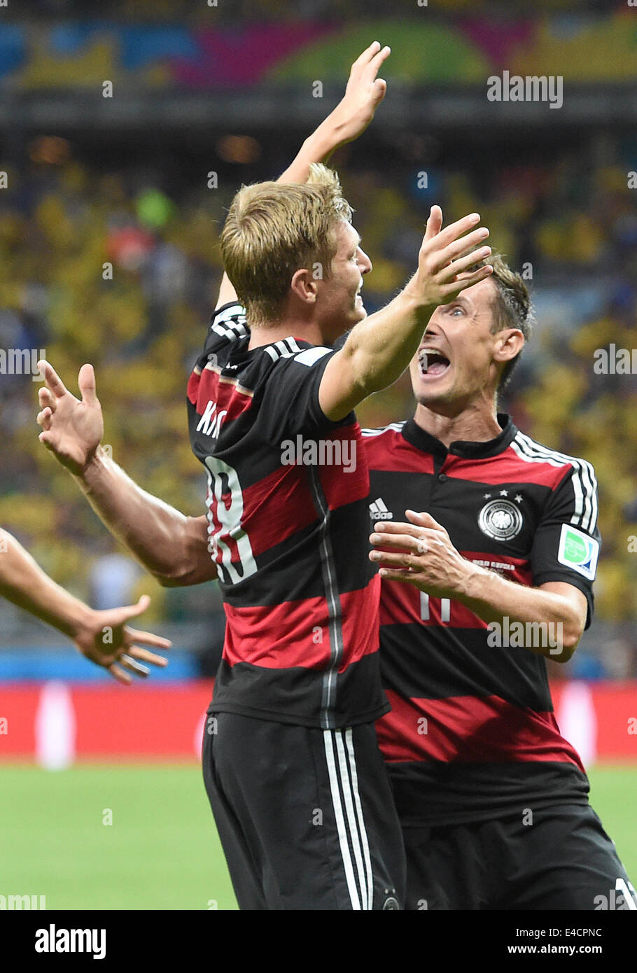 Belo Horizonte, Brazil. 08th July, 2014. Toni Kroos (L) of Germany celebrates with his teammmate Miroslav Klose (R) after scoring 0-3 goal during the FIFA World Cup 2014 semi-final soccer match between Brazil and Germany at Estadio Mineirao in Belo Horizonte, Brazil, 08 July 2014. Photo: Marcus Brandt/dpa/Alamy Live News Stock Photo