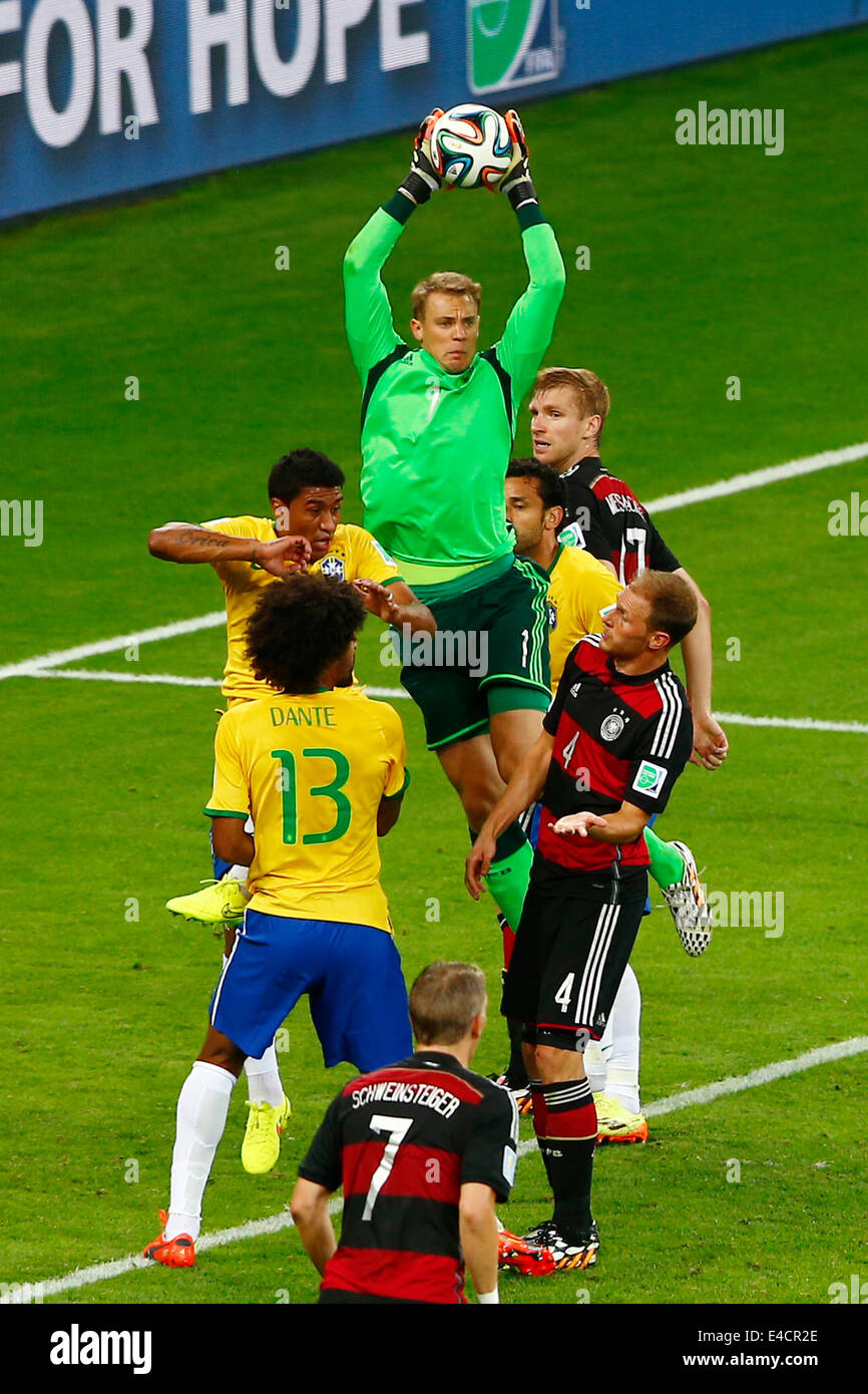 Belo Horizonte, Brazil. 8th July, 2014. Germany's goalkeeper Manuel Neuer (up) grabs the ball during a semifinal match between Brazil and Germany of 2014 FIFA World Cup at the Estadio Mineirao Stadium in Belo Horizonte, Brazil, on July 8, 2014. Credit:  Liu Bin/Xinhua/Alamy Live News Stock Photo
