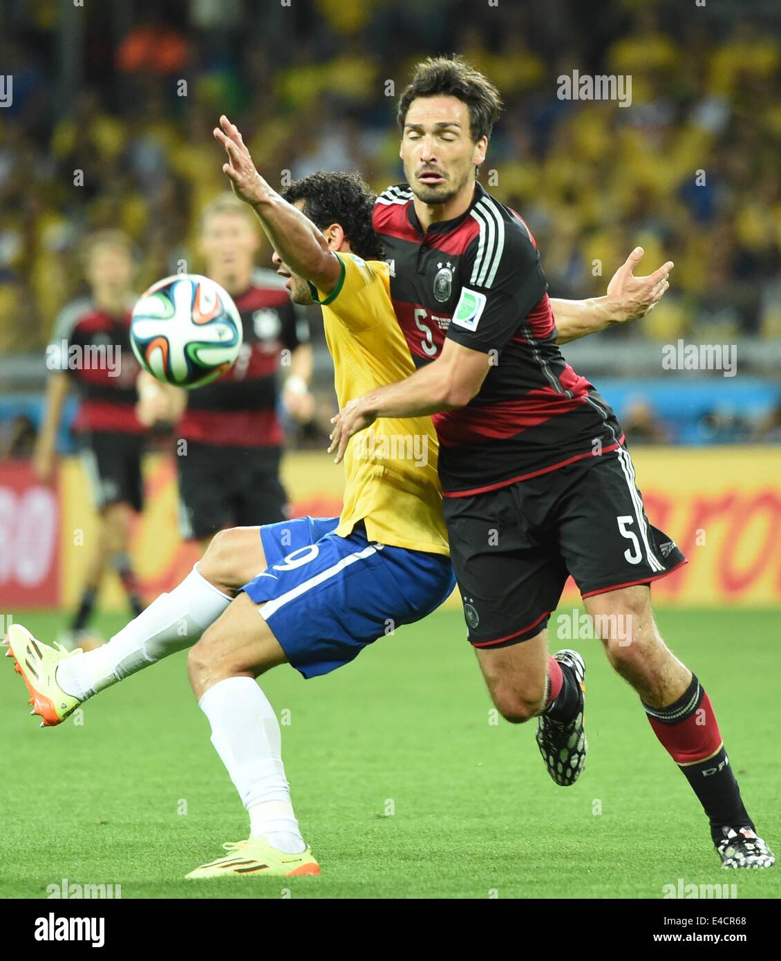Belo Horizonte, Brazil. 8th July, 2014. Germany's Mats Hummels (R) vies with Brazil's Fred during a semifinal match between Brazil and Germany of 2014 FIFA World Cup at the Estadio Mineirao Stadium in Belo Horizonte, Brazil, on July 8, 2014. Credit:  Liu Dawei/Xinhua/Alamy Live News Stock Photo