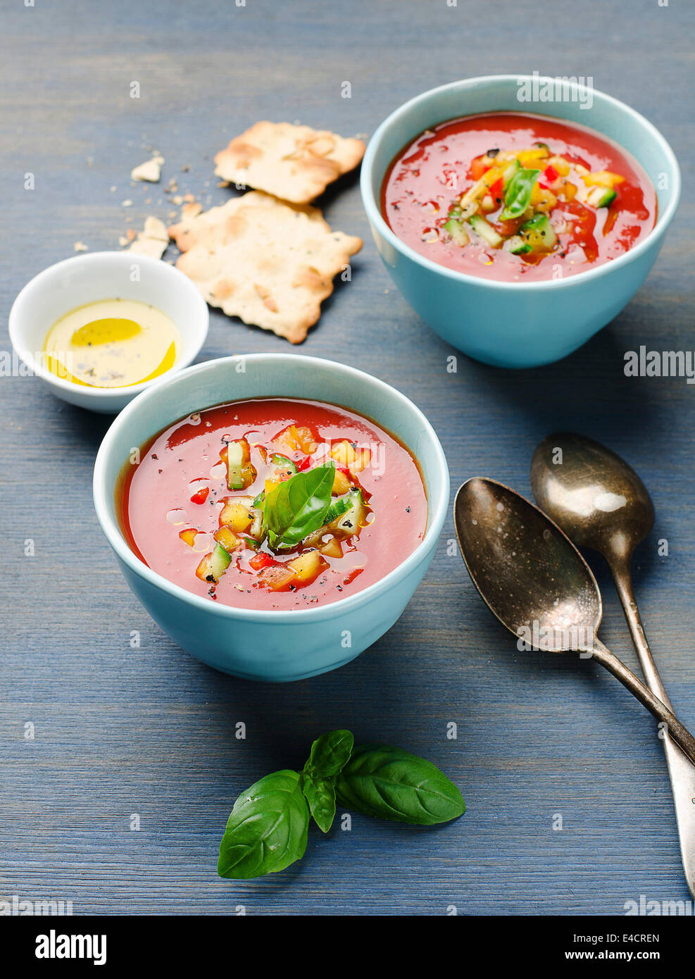 Tomato soup Gazpacho on blue background Stock Photo