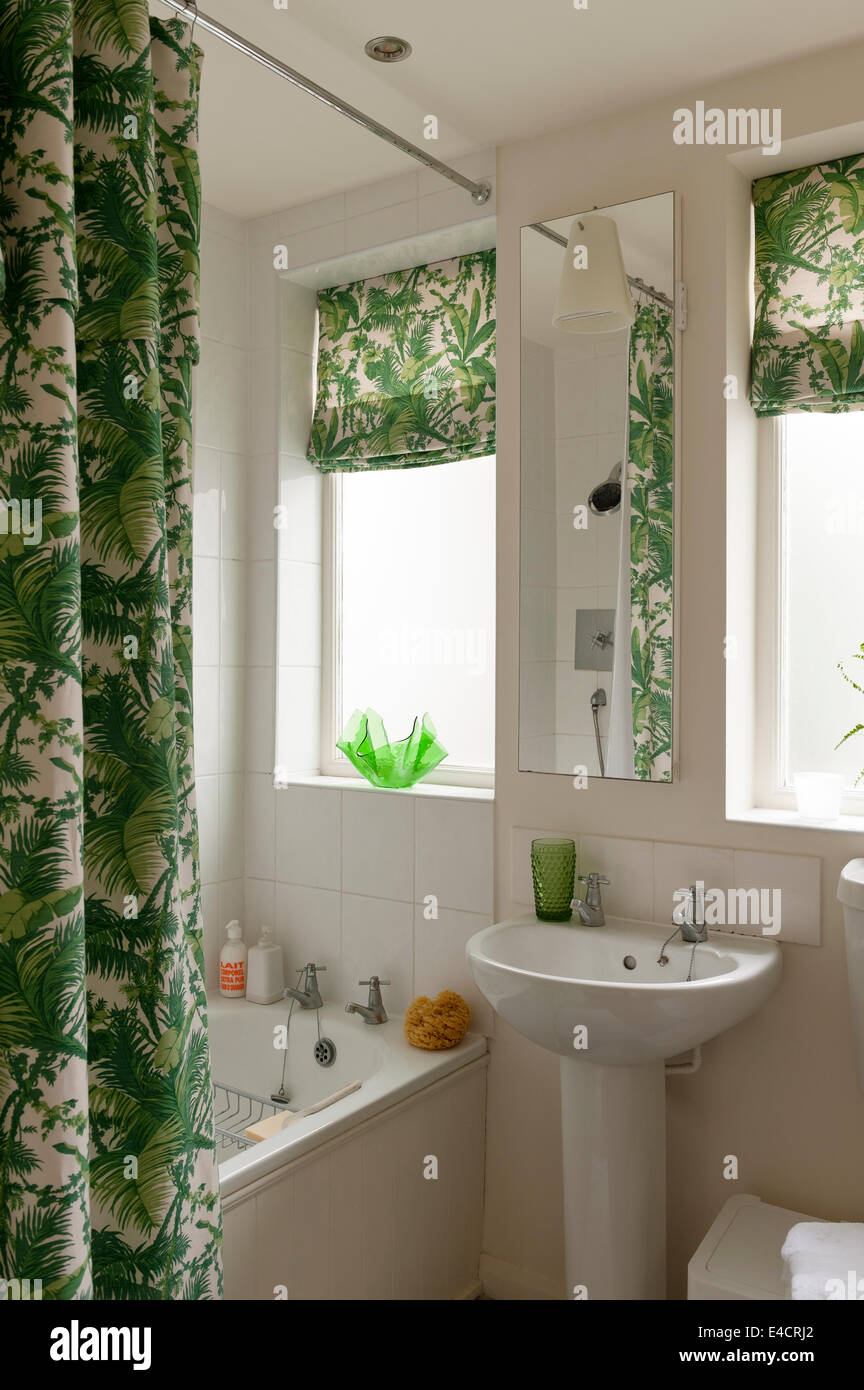 Bathroom with Waikiki by Bennison shower curtain and blinds Stock Photo