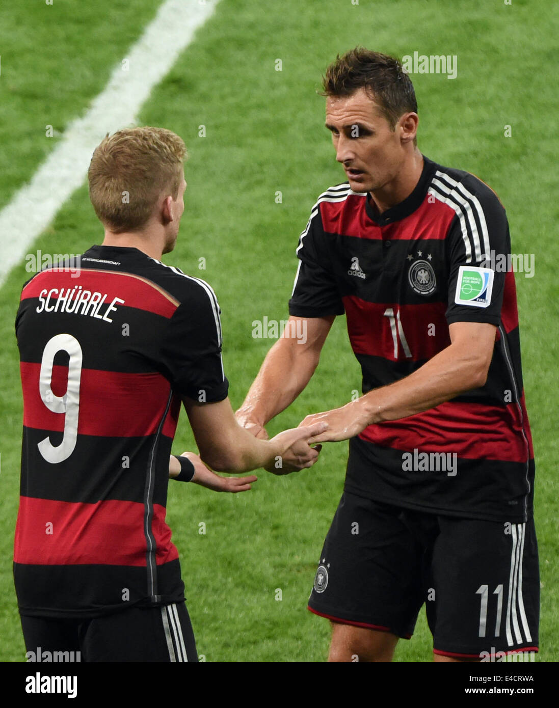 Belo Horizonte, Brazil. 08th July, 2014. Germany's Miroslav Klose (R) is substituted by Andre Schuerrle during the FIFA World Cup 2014 semi-final soccer match between Brazil and Germany at Estadio Mineirao in Belo Horizonte, Brazil, 08 July 2014. Photo: Andreas Gebert/dpa/Alamy Live News Stock Photo