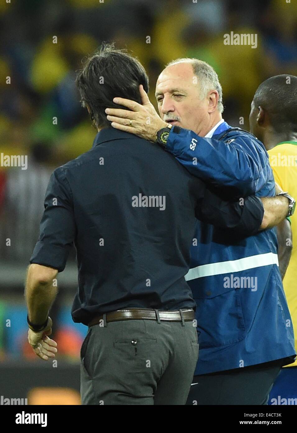 Belo Horizonte, Brazil. 8th July, 2014. Brazil's coach Luiz Felipe Scolari (C) greets Germany's coach Joachim Loew after a semifinal match between Brazil and Germany of 2014 FIFA World Cup at the Estadio Mineirao Stadium in Belo Horizonte, Brazil, on July 8, 2014. Germany won 7-1 over Brazil and qualified for the final on Tuesday. Credit:  Liu Dawei/Xinhua/Alamy Live News Stock Photo
