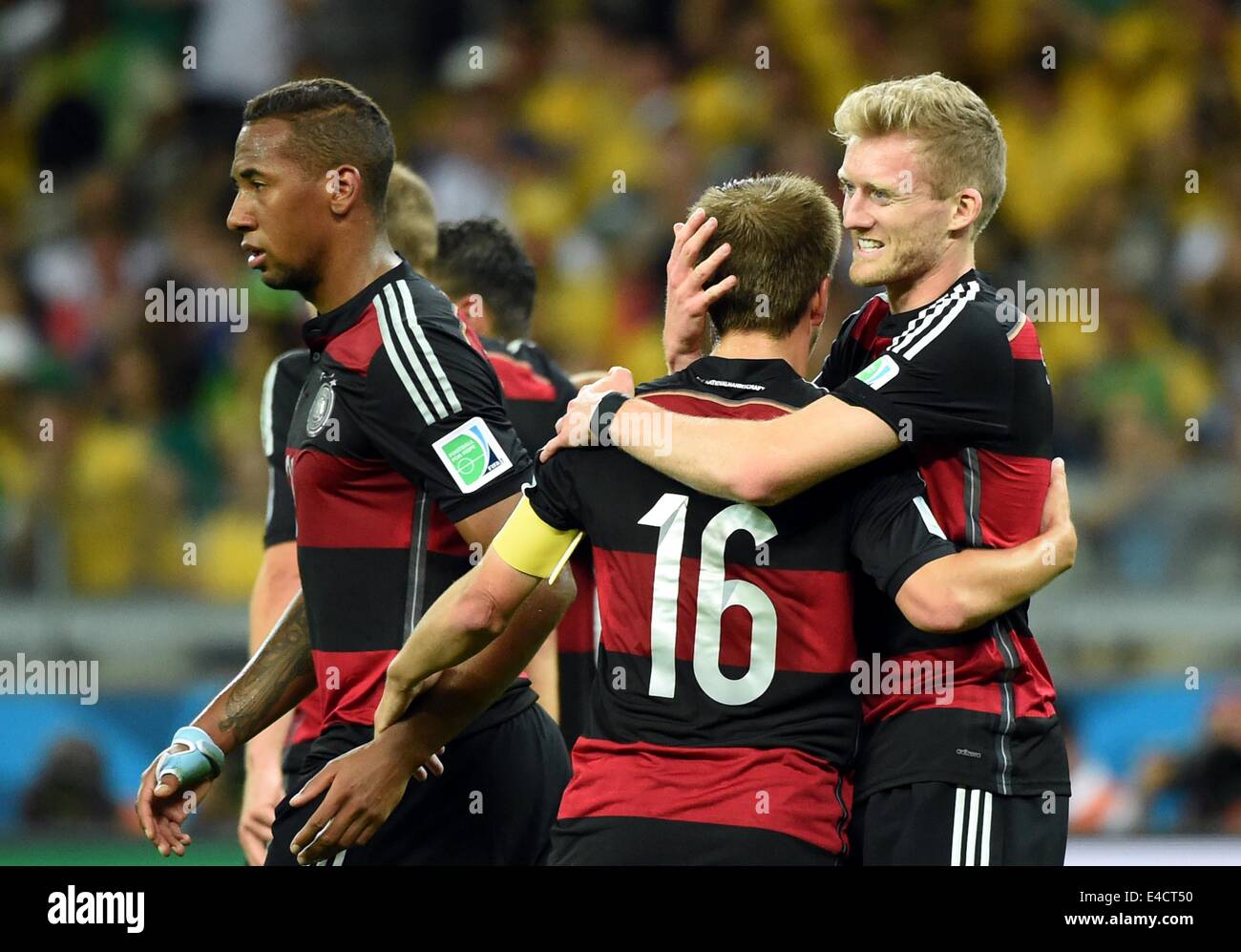 Belo Horizonte, Brazil. 8th July, 2014. Germany's Andre Schuerrle (1st R) celebrates with Philipp Lahm (2nd R) after scoring during a semifinal match between Brazil and Germany of 2014 FIFA World Cup at the Estadio Mineirao Stadium in Belo Horizonte, Brazil, on July 8, 2014. Germany won 7-1 over Brazil and qualified for the final on Tuesday. Credit:  Liu Dawei/Xinhua/Alamy Live News Stock Photo