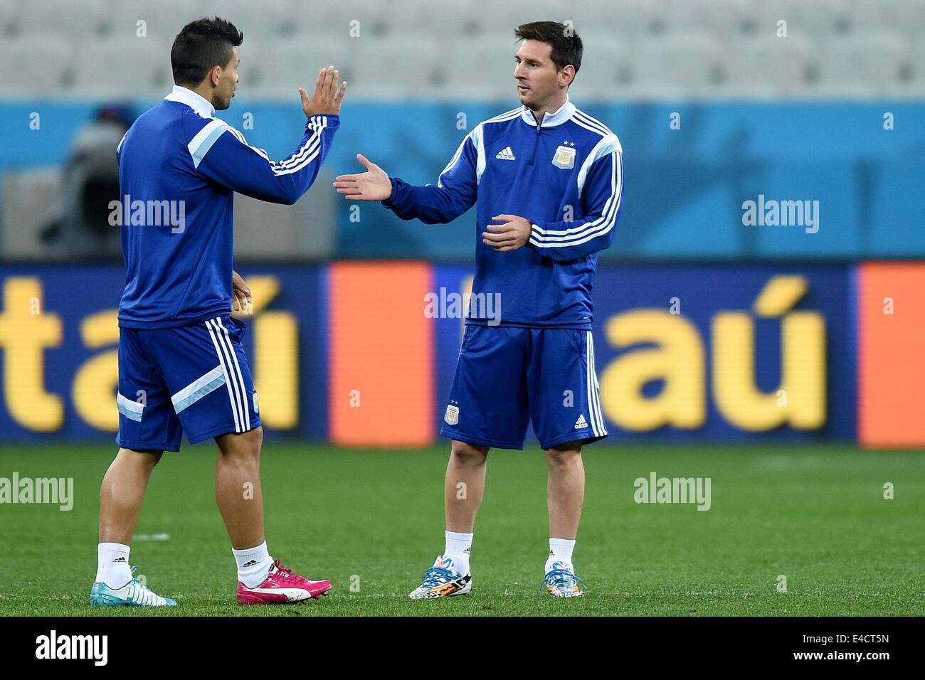 Sao Paulo, Brazil. 08th July, 2014. Argentina's Lionel Messi (R) and Sergio Aguero practices during a training session at the Arena Corinthians in Sao Paulo, Brazil, 08 July 2014. Argentina will play a FIFA World Cup semi final match against the Netherlands on 09 July 2014. Photo: Marius Becker/dpa/Alamy Live News Stock Photo