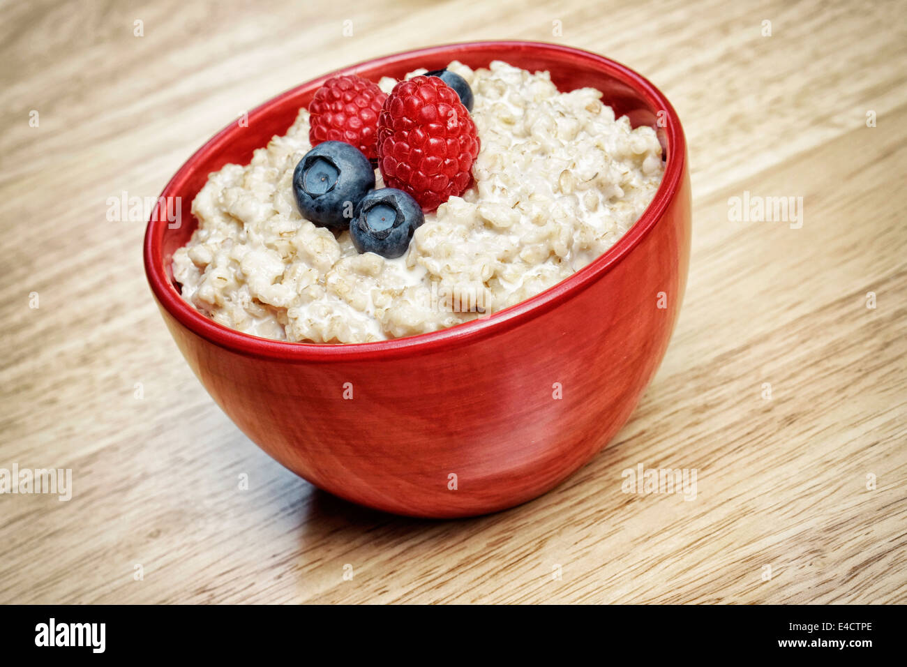 Oatmeal Porridge, Bowl of Oatmeal Porridge with Berries Stock Photo