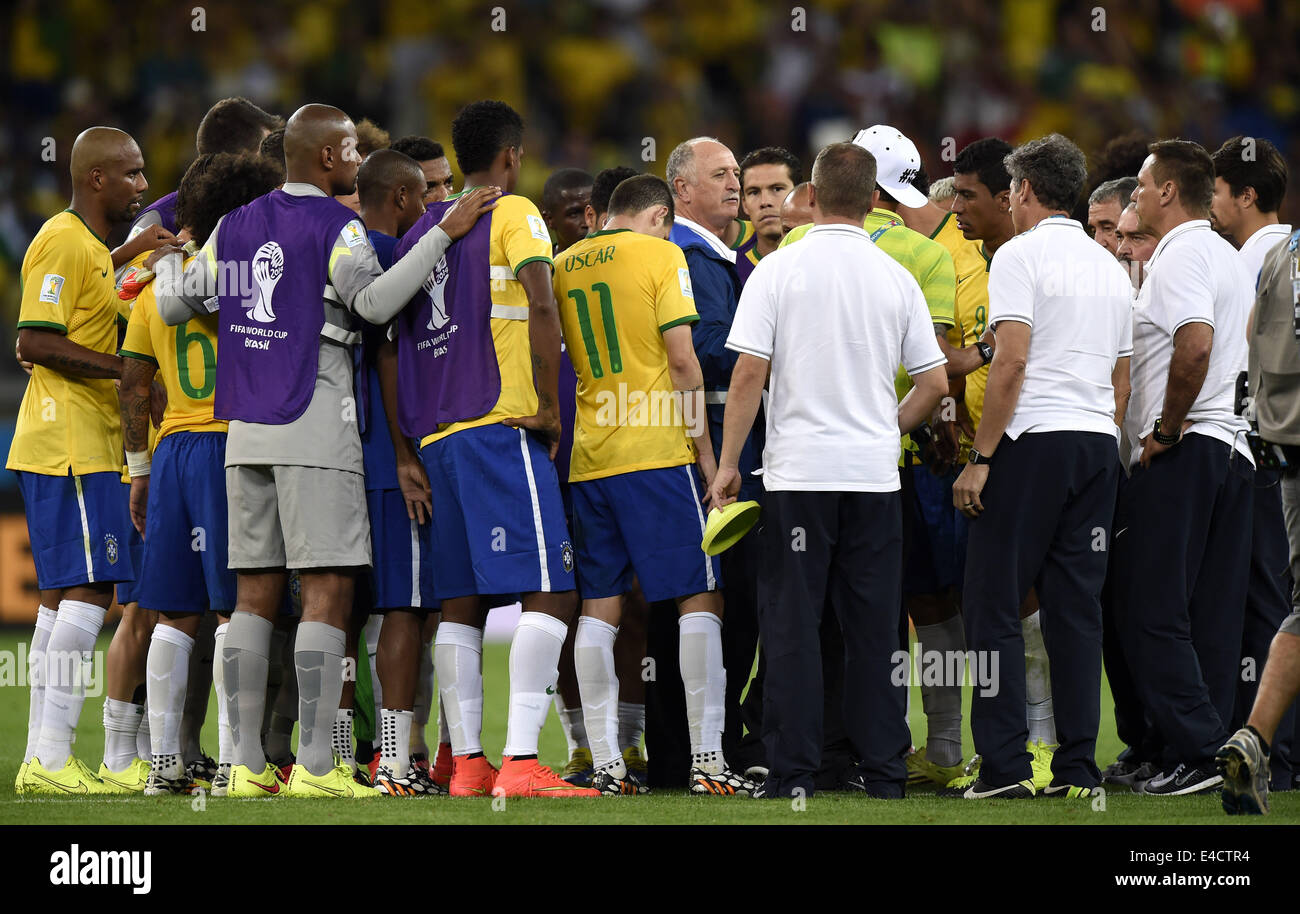 Belo Horizonte, Brazil. 8th July, 2014. Brazil's coach Luiz Felipe Scolari (C) is seen with his team after a semifinal match between Brazil and Germany of 2014 FIFA World Cup at the Estadio Mineirao Stadium in Belo Horizonte, Brazil, on July 8, 2014. Germany won 7-1 over Brazil and qualified for the final on Tuesday. Credit:  Qi Heng/Xinhua/Alamy Live News Stock Photo