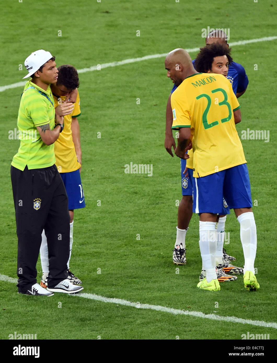 Belo Horizonte, Brazil. 08th July, 2014. Brazil's Thiago Silva (L) hugs Oscar next to Maicon (R) after the FIFA World Cup 2014 semi-final soccer match between Brazil and Germany at Estadio Mineirao in Belo Horizonte, Brazil, 08 July 2014. Photo: Andreas Gebert/dpa/Alamy Live News Stock Photo
