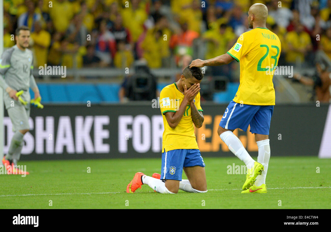 Belo Horizonte, Brazil. 08th July, 2014. Luiz Gustavo (C) of Brazil and Maicon (R) react after the FIFA World Cup 2014 semi-final soccer match between Brazil and Germany at Estadio Mineirao in Belo Horizonte, Brazil, 08 July 2014. Photo: Thomas Eisenhuth/dpa/Alamy Live News Stock Photo