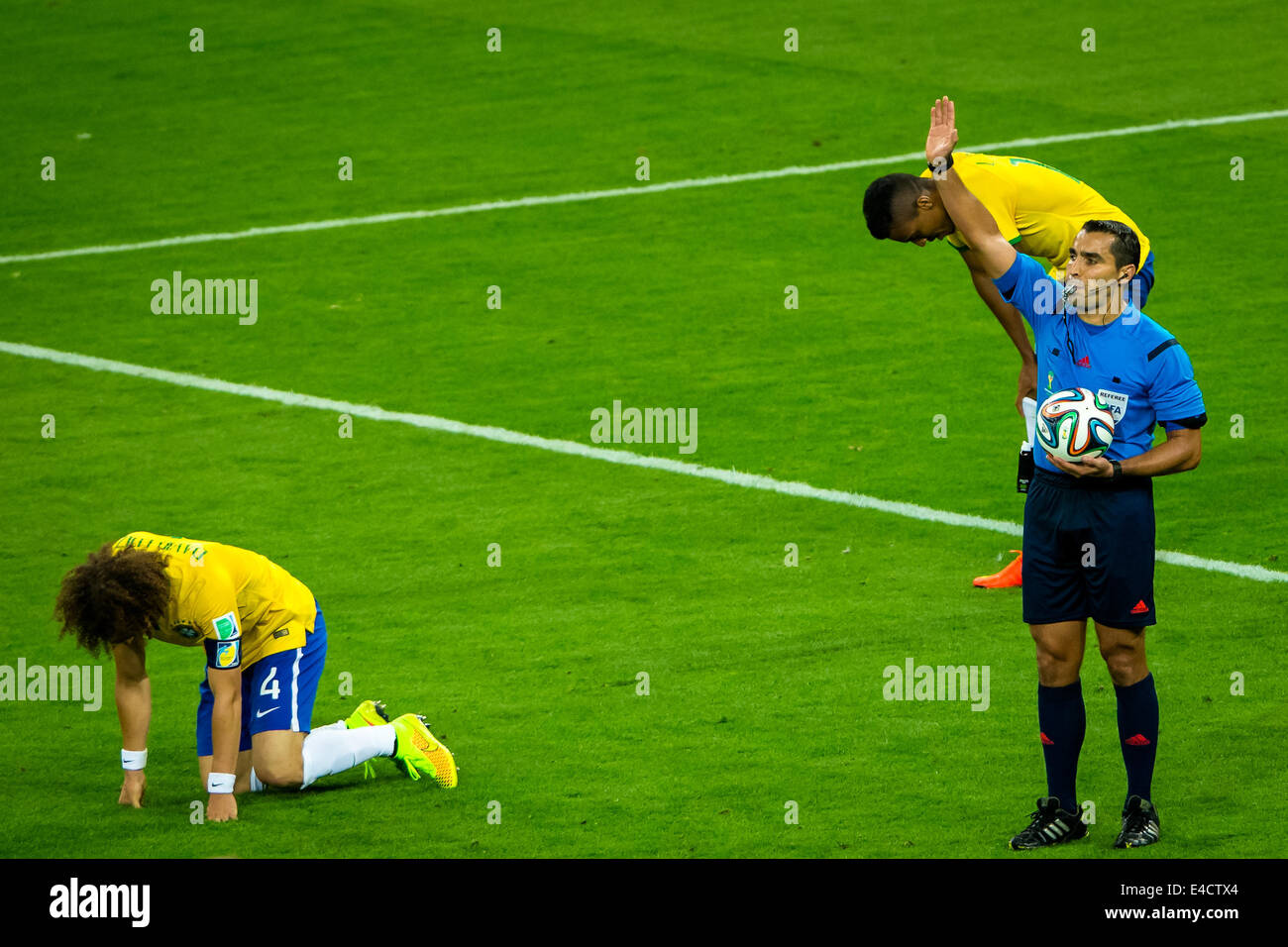 Belo Horizonte, Brazil. 8th July, 2014. Mexico's referee Marco Rodriguez (R) blows the final whistle at the end of a semifinal match between Brazil and Germany of 2014 FIFA World Cup at the Estadio Mineirao Stadium in Belo Horizonte, Brazil, on July 8, 2014. Germany won 7-1 over Brazil and qualified for the final on Tuesday. Credit:  Li Bin/Xinhua/Alamy Live News Stock Photo
