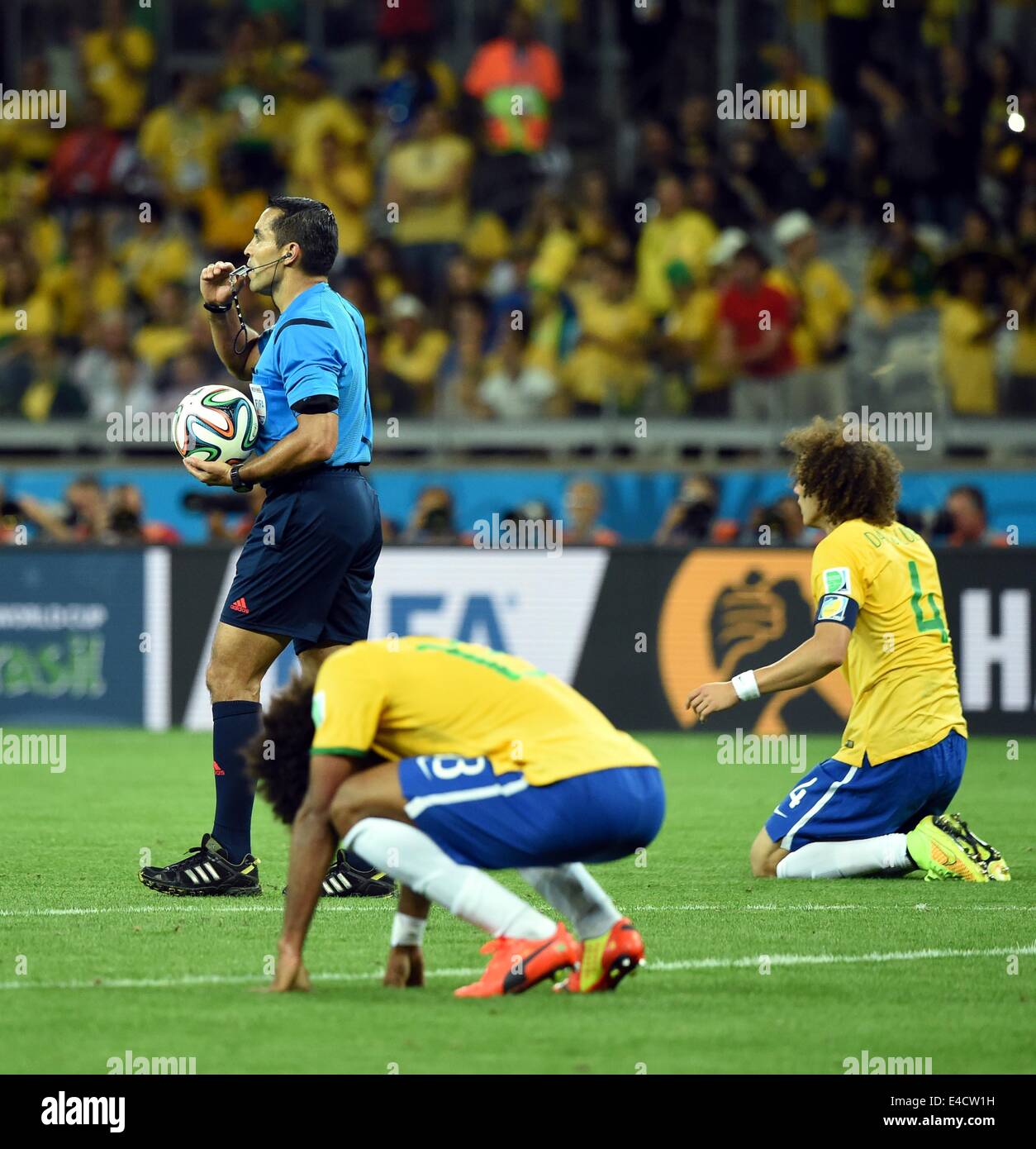 Belo Horizonte, Brazil. 8th July, 2014. Mexico's referee Marco Rodriguez (L) blows the final whistle at the end of a semifinal match between Brazil and Germany of 2014 FIFA World Cup at the Estadio Mineirao Stadium in Belo Horizonte, Brazil, on July 8, 2014. Germany won 7-1 over Brazil and qualified for the final on Tuesday. Credit:  Liu Dawei/Xinhua/Alamy Live News Stock Photo