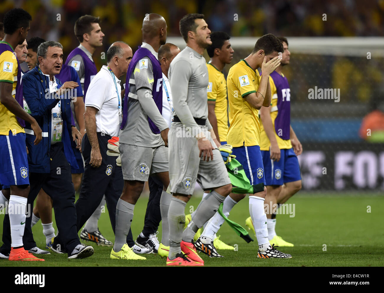 Belo Horizonte, Brazil. 8th July, 2014. Brazil's players leave the field after a semifinal match between Brazil and Germany of 2014 FIFA World Cup at the Estadio Mineirao Stadium in Belo Horizonte, Brazil, on July 8, 2014. Germany won 7-1 over Brazil and qualified for the final on Tuesday. Credit:  Qi Heng/Xinhua/Alamy Live News Stock Photo