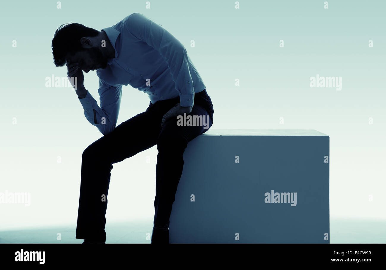 Exhausted miserable guy with big problem Stock Photo