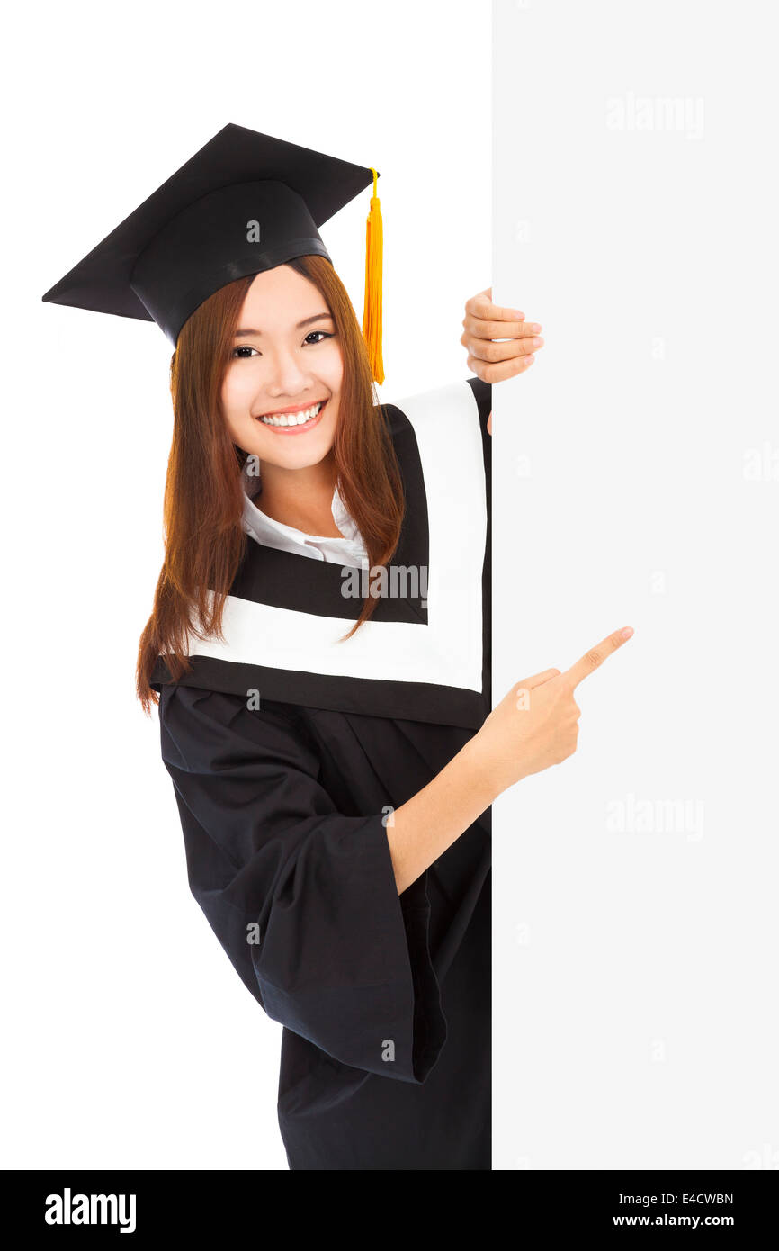 young female graduation students point to blank board Stock Photo