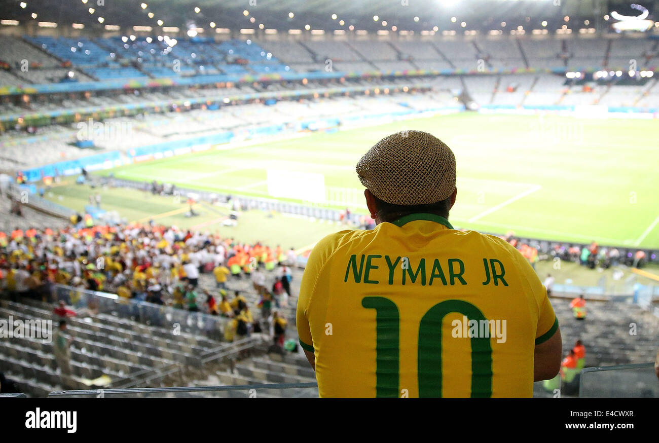 Belo Horizonte, Brazil. 8th July, 2014. A Brazil's fan sits on the stand after a semifinal match between Brazil and Germany of 2014 FIFA World Cup at the Estadio Mineirao Stadium in Belo Horizonte, Brazil, on July 8, 2014. Germany won 7-1 over Brazil and qualified for the final on Tuesday. Credit:  Li Ming/Xinhua/Alamy Live News Stock Photo