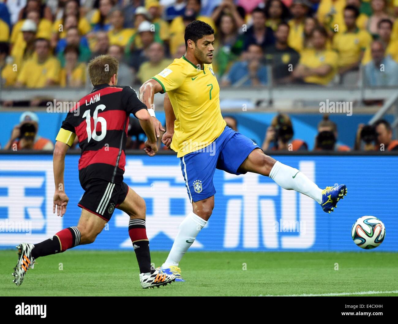 Belo Horizonte, Brazil. 8th July, 2014. Brazil's Hulk (R) vies with Germany's Philipp Lahm during a semifinal match between Brazil and Germany of 2014 FIFA World Cup at the Estadio Mineirao Stadium in Belo Horizonte, Brazil, on July 8, 2014. Germany won 7-1 over Brazil and qualified for the final on Tuesday. Credit:  Liu Dawei/Xinhua/Alamy Live News Stock Photo