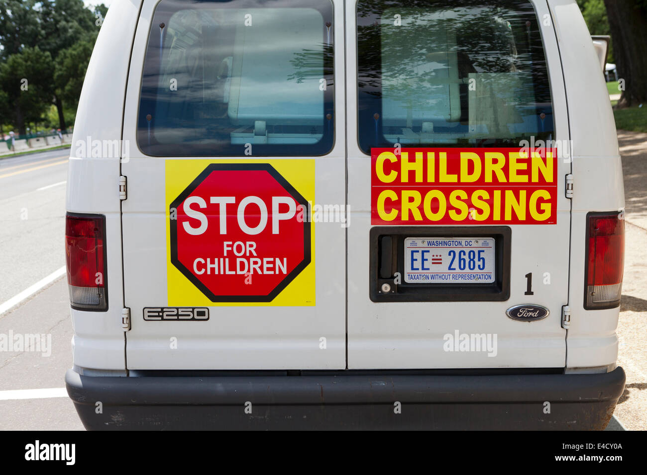 Children crossing warning signs on back of ice cream truck ...