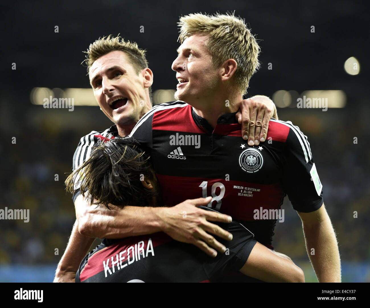 Belo Horizonte, Brazil. 8th July, 2014. Germany's Miroslav Klose (L, back) and Sami Khedira (L, front) with Toni Kroos (R) for Toni's second goal during a semifinal match between Brazil and Germany of 2014 FIFA World Cup at the Estadio Mineirao Stadium in Belo Horizonte, Brazil, on July 8, 2014. Credit:  Qi Heng/Xinhua/Alamy Live News Stock Photo