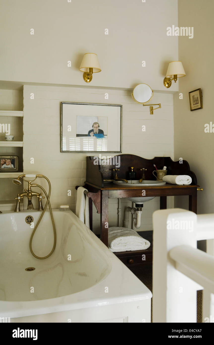 Cosy bathroom with old fashioned wooden washstand Stock Photo