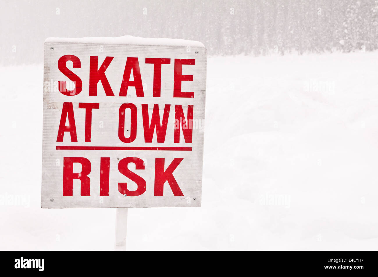 Skate At Own Risk, sign at Lake Louise, Banff National Park, Alberta Stock Photo