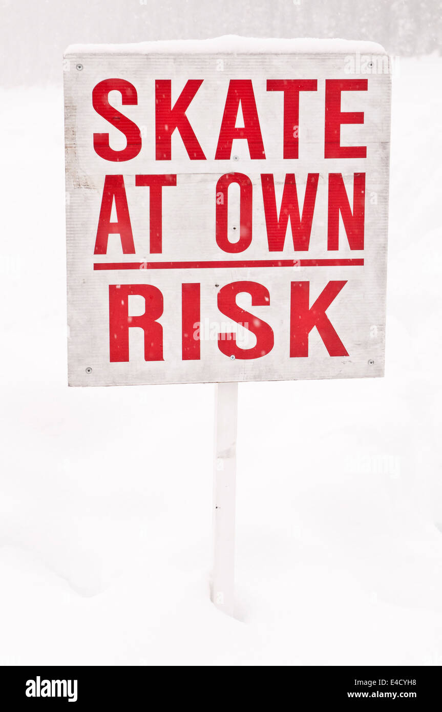 Skate At Own Risk, sign at Lake Louise, Banff National Park, Alberta Stock Photo