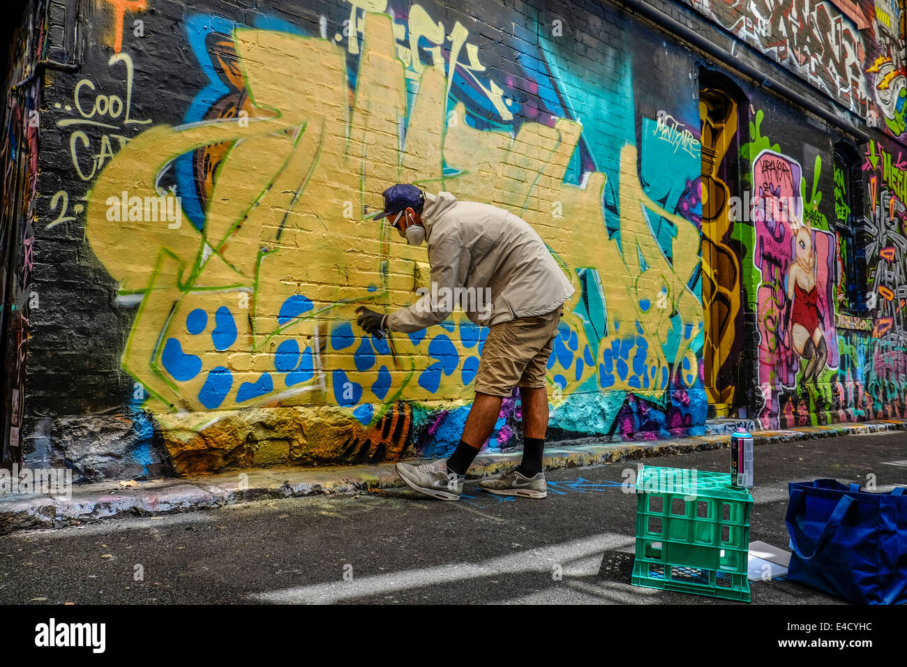 Graffiti artist at work in Melbourne laneway Stock Photo Alamy
