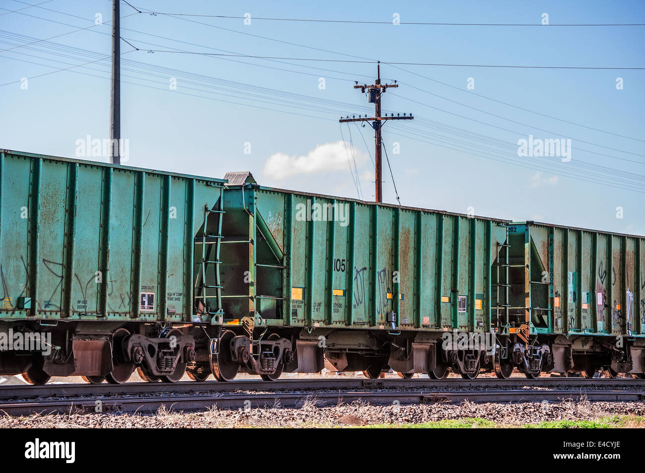 Railcars waiting on a siding for their turn to be loaded. Stock Photo