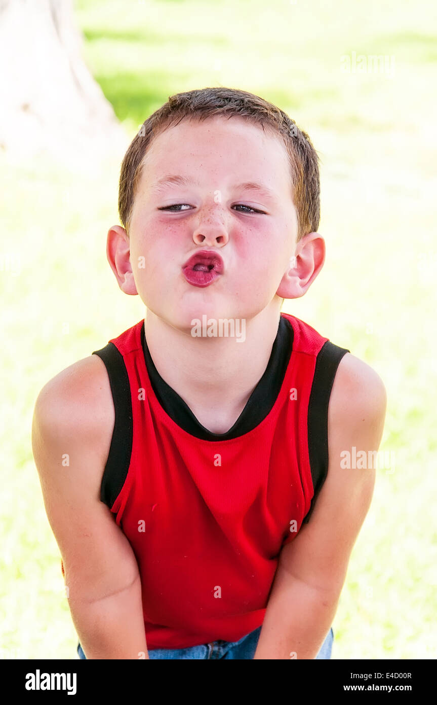 Cute little boy being playful and making funny faces Stock Photo