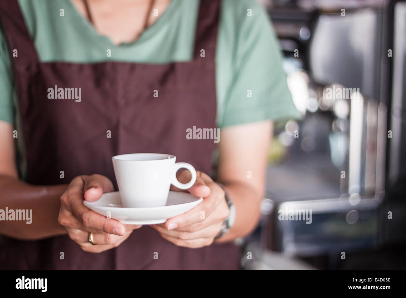 Asian barista serving freshly brewed coffee, stock photo Stock Photo