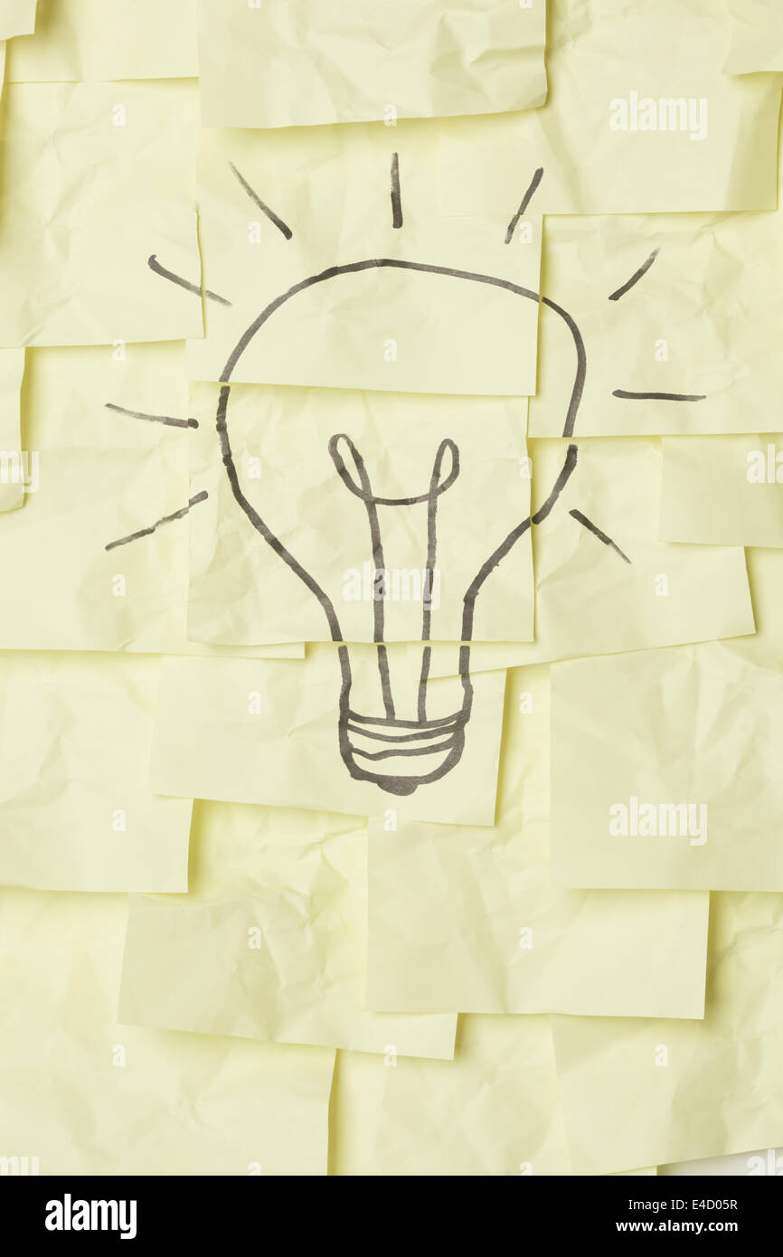 Lightbulb on sticky notes Stock Photo