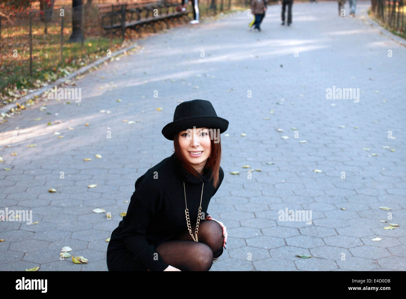 Lovely asian woman kneeling in hi-res stock photography and images - Alamy