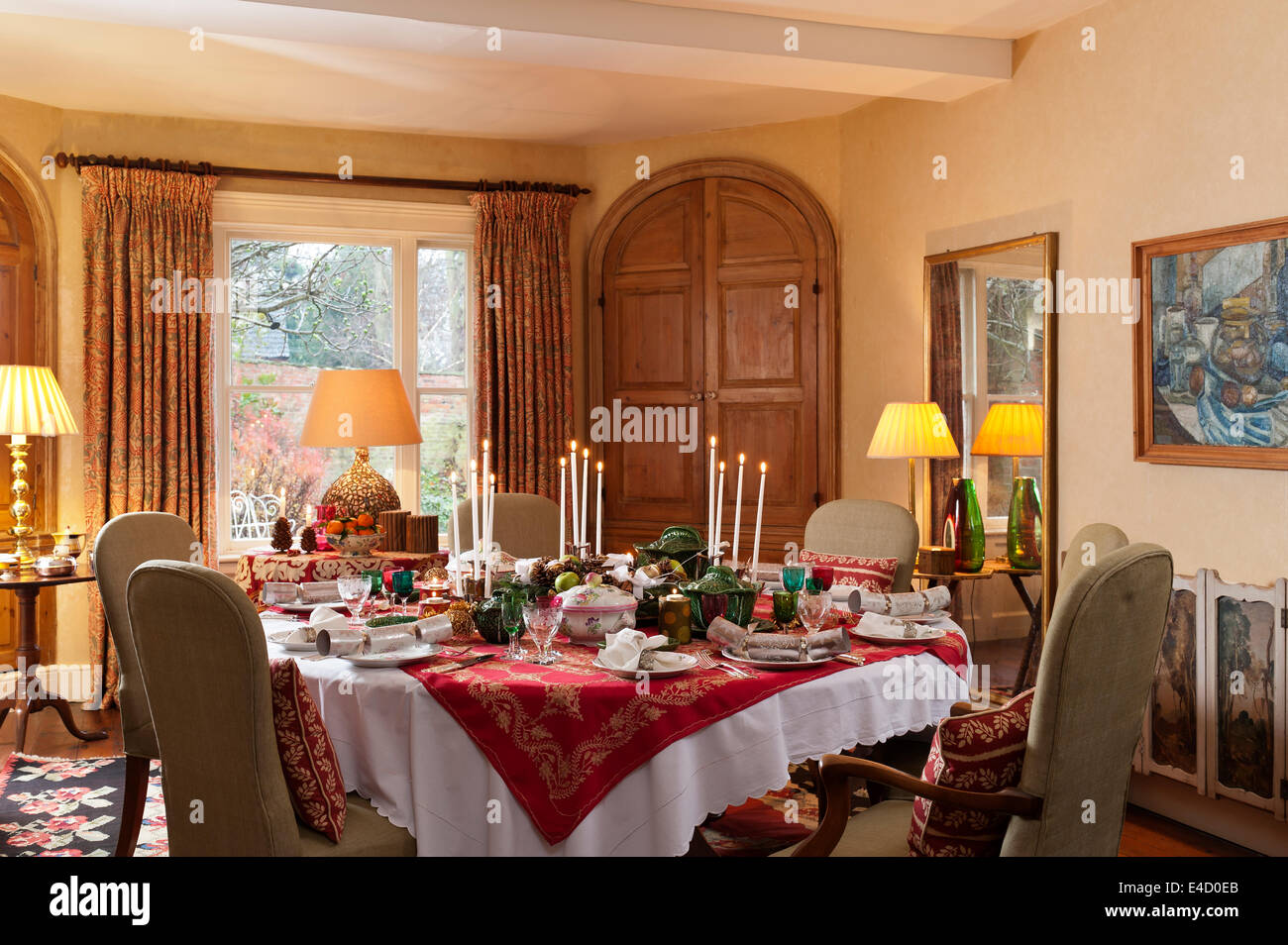 Dining room with table laid for christmas dinner. The tableware is a mix of Luneville Old Strasbourg pattern china and etched Vi Stock Photo