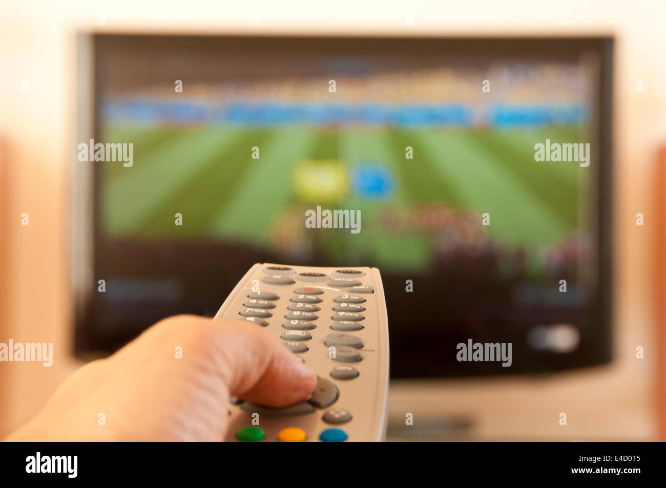 watching football in tv Stock Photo