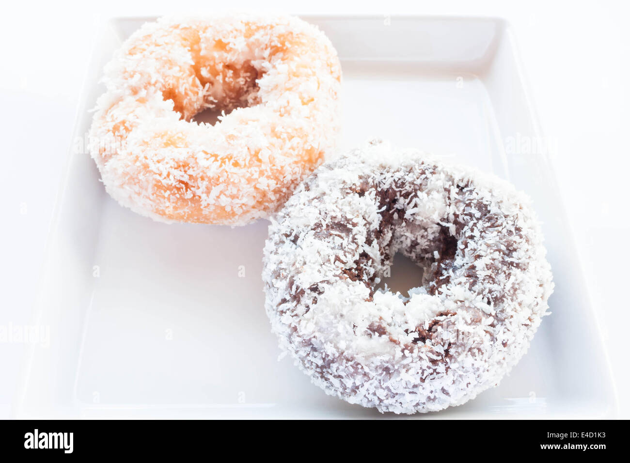 Chocolate and vanilla donuts with coconut cover, stock photo Stock Photo