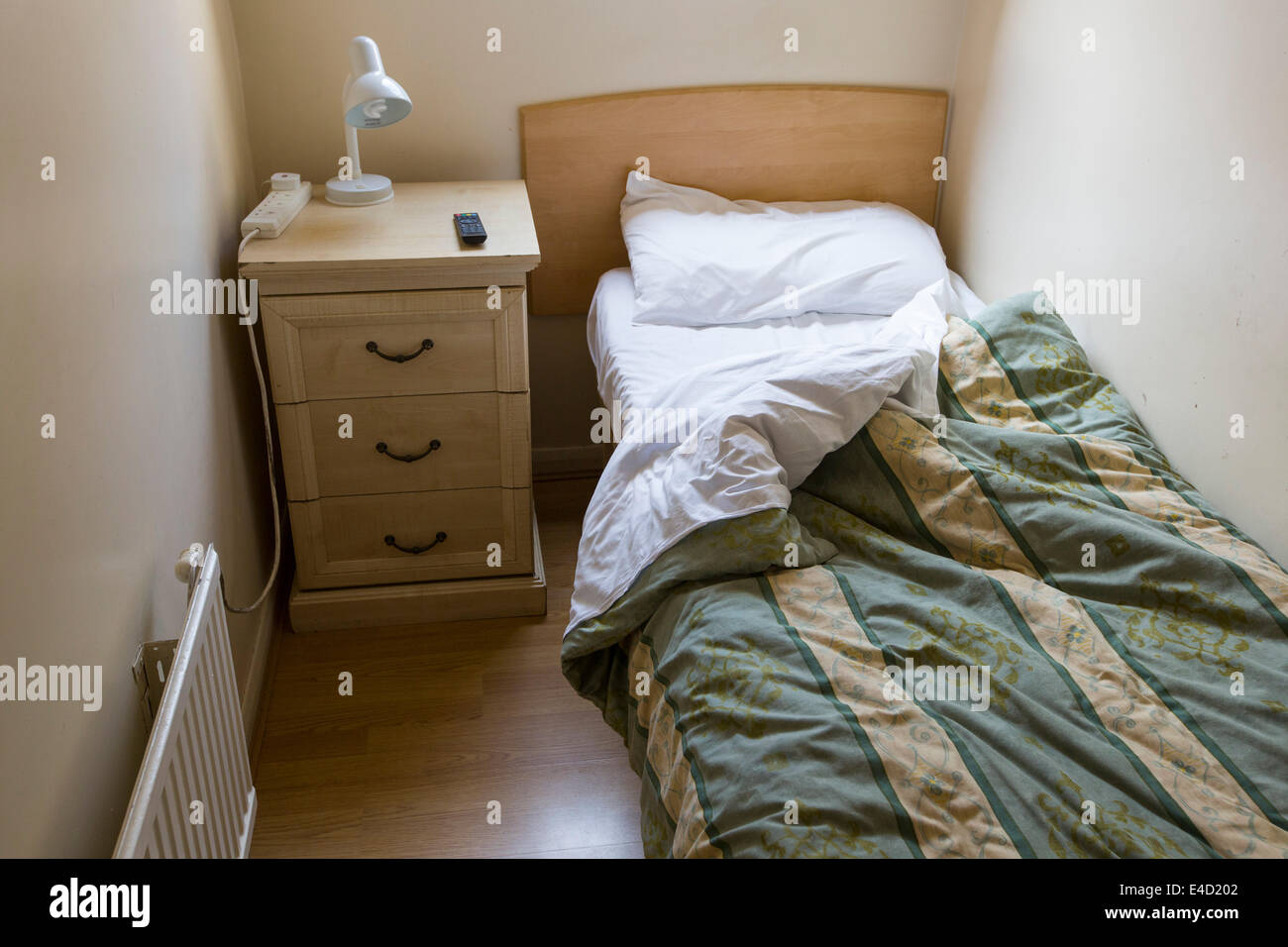 A tiny bedroom in a cheap London hotel, UK. Stock Photo