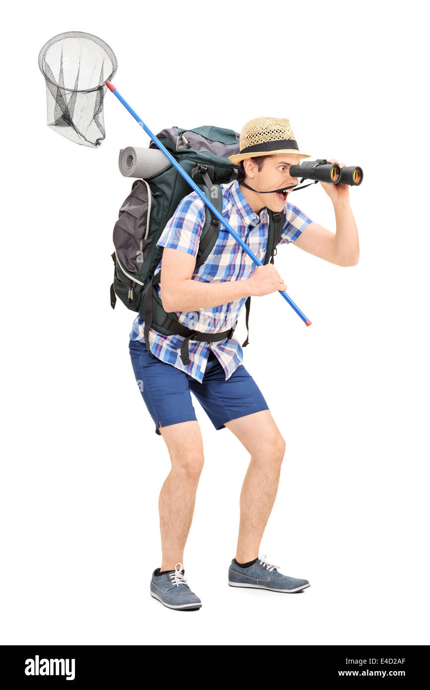 Full length portrait of a guy with butterfly net looking through binoculars Stock Photo